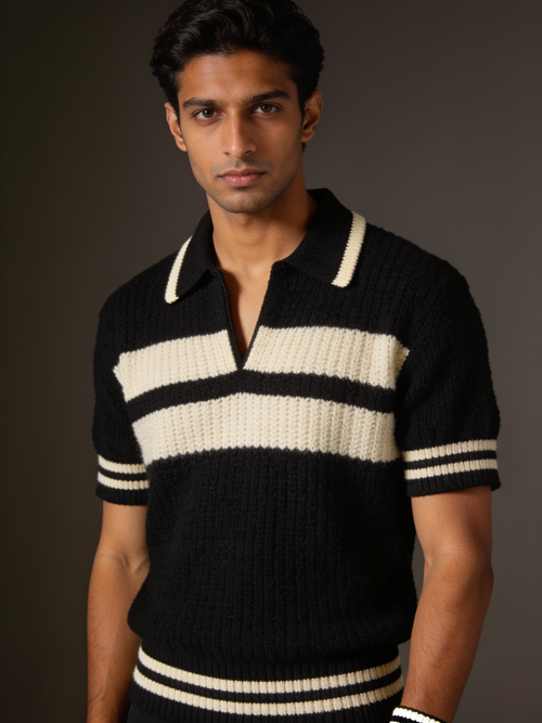 Model wearing The Interval textured knit polo in black with two ecru chest stripes and an ecru-tipped collar