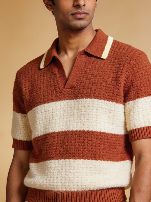 Close view of The Awning knit polo in wide rust and ecru waffle-texture stripes with an ecru-tipped collar