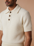 Model wearing The Plain Hour wide-rib knit polo in undyed ecru with three horn-finish buttons