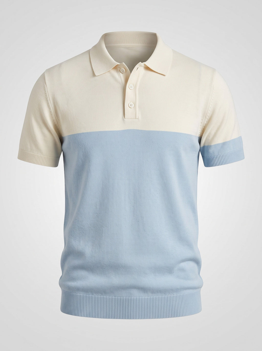 The Deck Chair knit polo shown front on, ecru yoke and sleeves above a pale blue body with blue ribbed cuffs